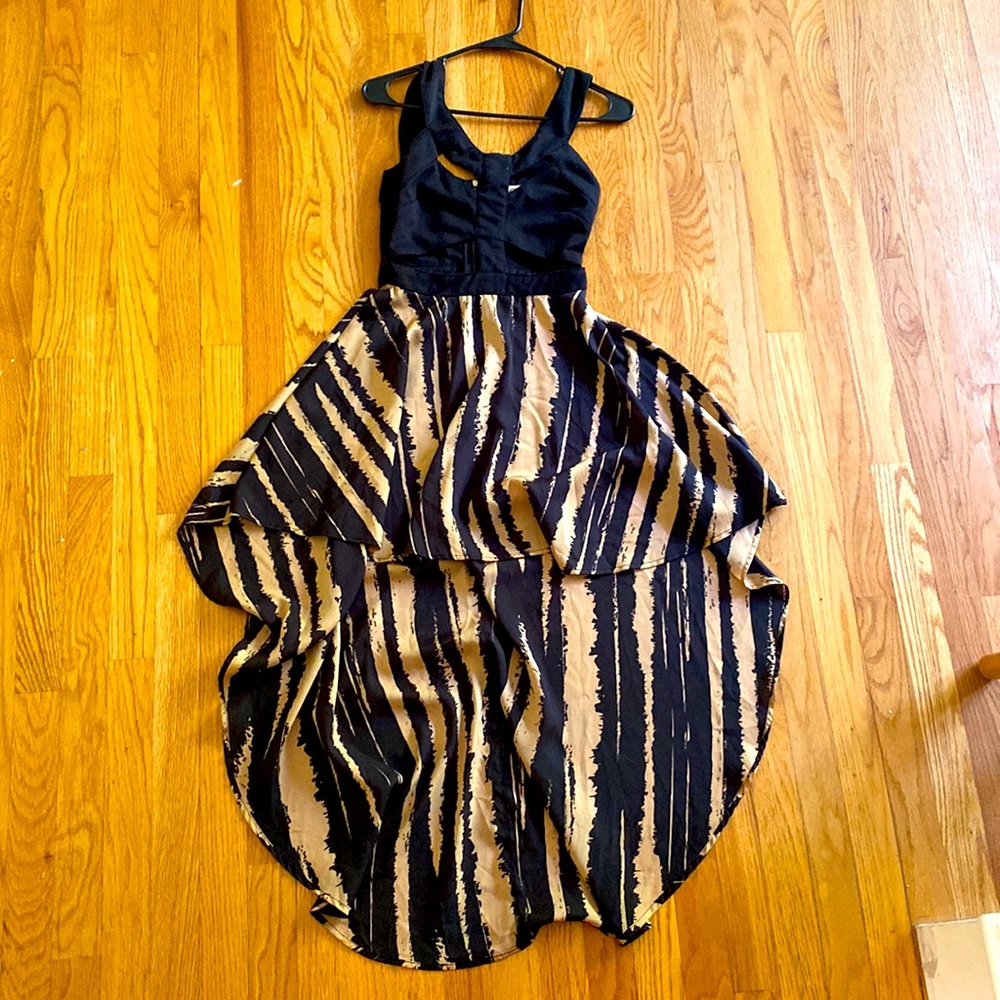 Size Medium “reverse” brand high low cut out dress.